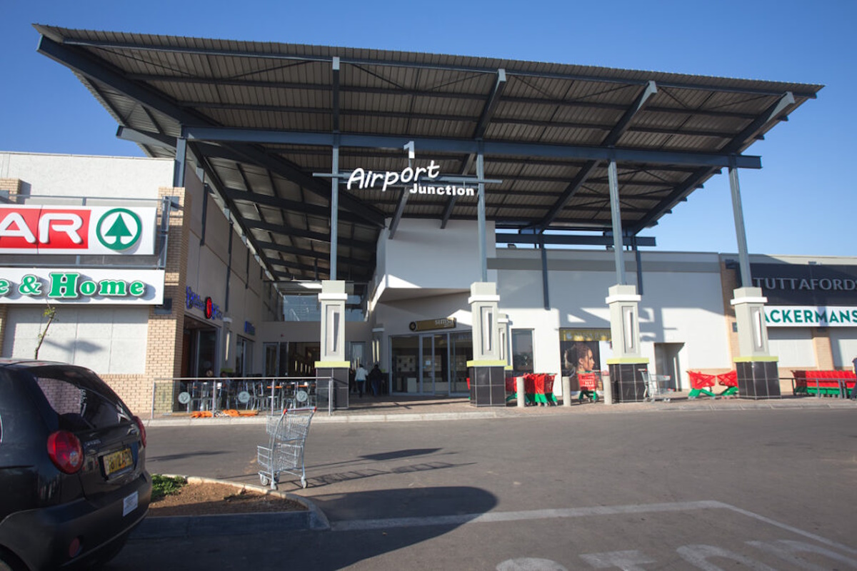 Airport Junction Shopping Centre exterior with modern architecture and bustling atmosphere